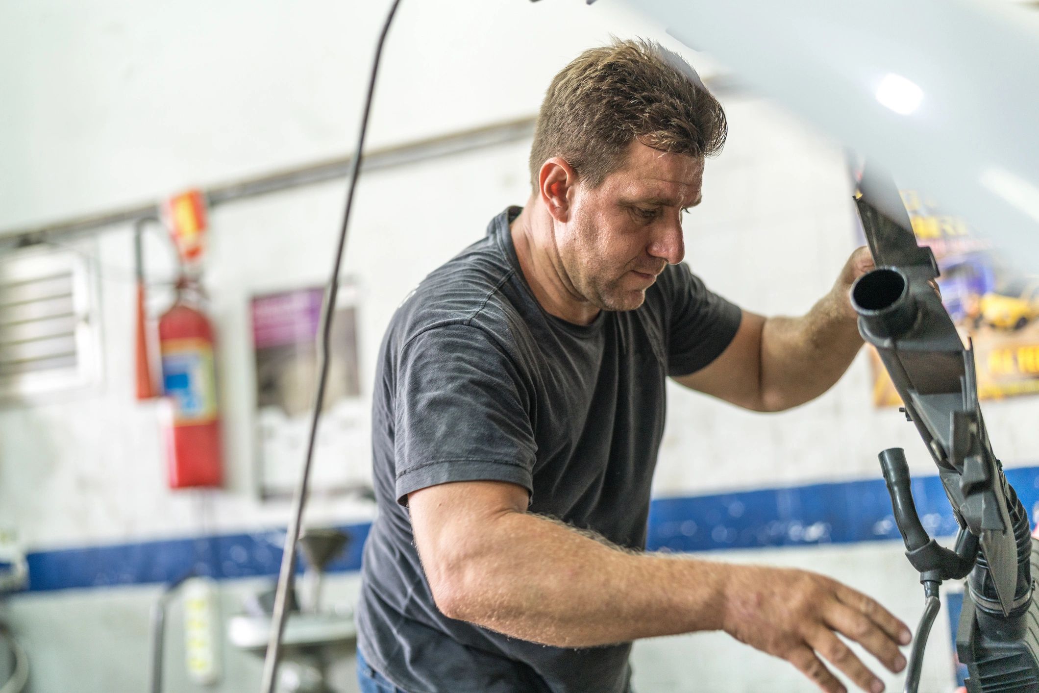 Mechanic working on a car in a professional shop
