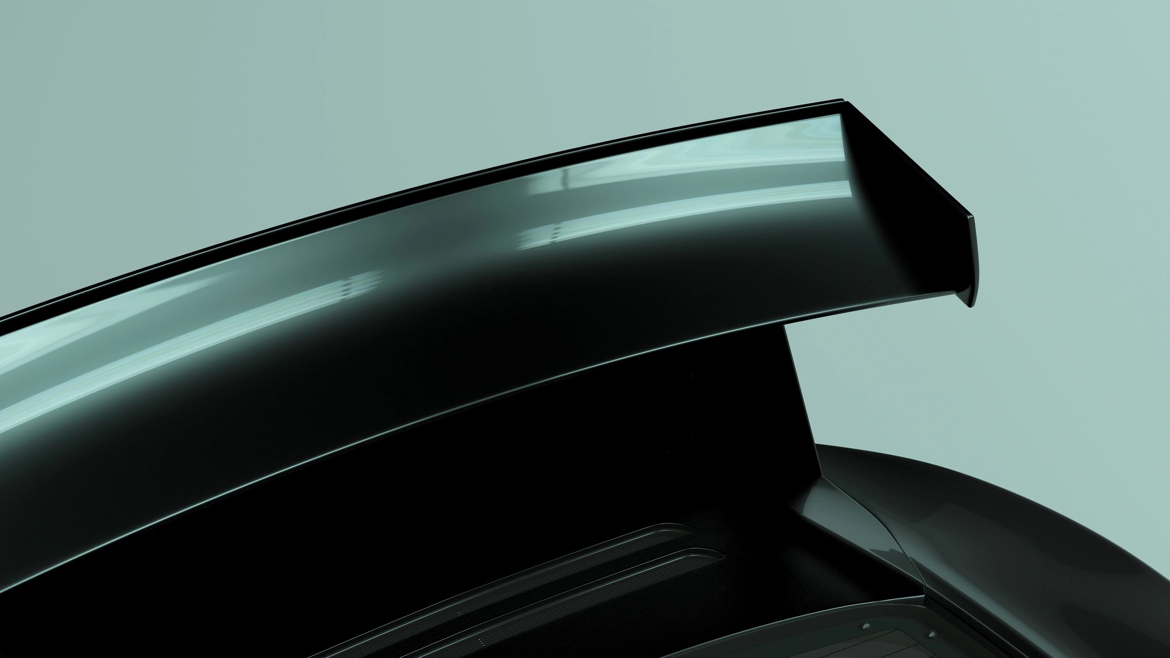 Close-up of a black sports car spoiler detail
